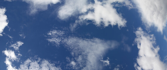 Blue sky with white clouds, panoramic sky, view up