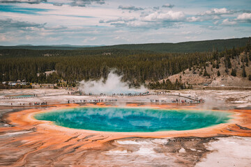 Tourists at grand prismatic spring, a view of grand prismatic spring from high vantage point, Yellowstone national Park, Wyoming