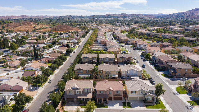 Daytime aerial view of a high density suburban neighborhood in Riverside, California, USA.