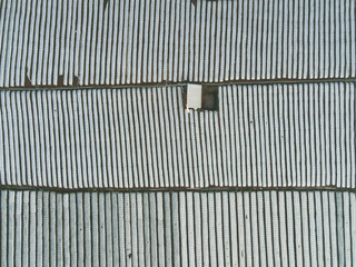 White spunbond rows on a farm field. Protective coating for corps and plants. Spunbond agrofibre...