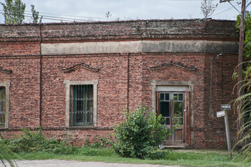 Old country house with brick front door and window