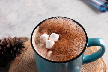 Blue mug with chocolate with mash mellows