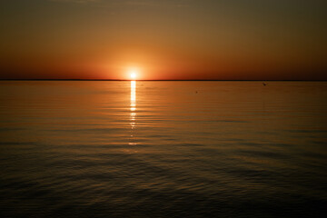 beautiful sunset over the calm sea.