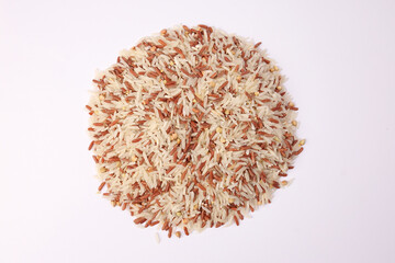 Mixed low glycaemic index healthy rice grain basmati millet buckwheat red rice heap on white...