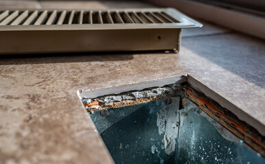 tiled open floor vent with cover removed