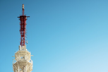 .Telecommunication tower against the blue sky, cell antenna, transmitter. TV tower