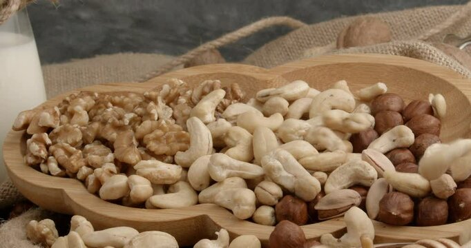 Different types of nuts, nuts in honey, nuts in slowmo, honey
