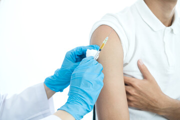 Female doctors vaccinated with syringes to prevent epidemics at hospitals, health care, and medical concepts