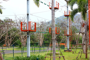 ropes balance station in amusement park. the game for trainning body balance on ropes and funny