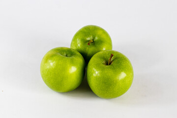 green apples on a white