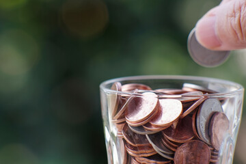 Golden coin on table background and business or finance saving money