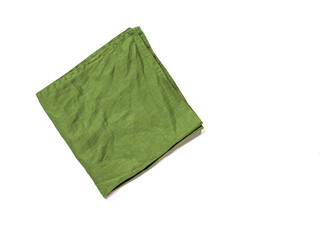 Green linen napkin isolated on white background.