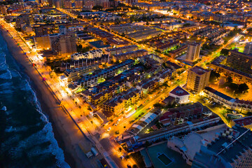 Fototapeta na wymiar Scenic night aerial view of Spanish tourist town of Oropesa del Mar on Mediterranean coast, Valencian Community