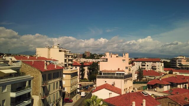 Motionlapse of clouds over buildings and traffic in Antibes, France