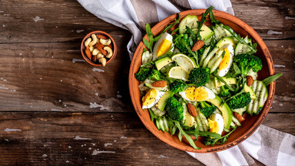 Healthy food. healthy vegan lunch bowl. Fresh green salad on dark woden background, banner, menu recipe place for text, top view