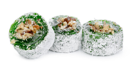 Green Turkish Delight with nuts on powdered sugar isolated on white