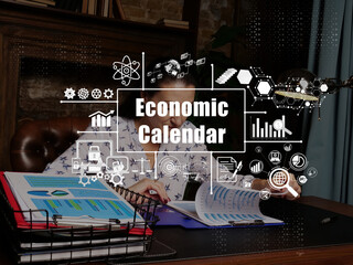 Financial concept about Economic Calendar with inscription. Young finance market analyst in eyeglasses working while sitting at wooden table on background.