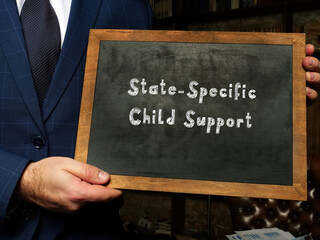 Financial concept meaning State-Specific Child Support with inscription on chalkboard.