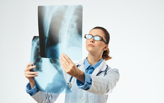 nurse with x-ray and medical gown glasses stethoscope
