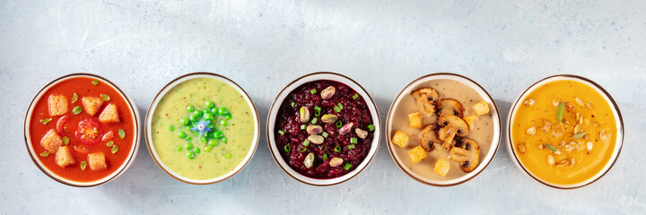 Vegan soup panorama with copy space. An assortment of vegetable cream soups