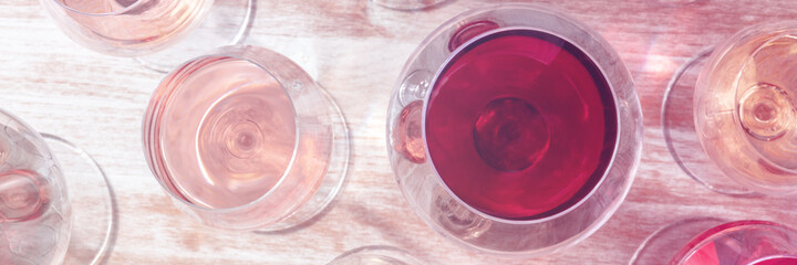 Wine panorama. Rose and red and white wines. Toned image