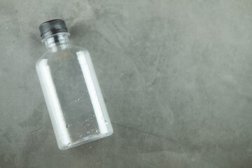 Plastic water bottle on a black background.