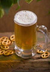Bavarian Oktoberfest beer and pretzels on wooden table