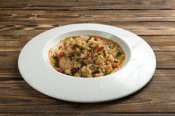 Rice with chicken and vegetables in sweet and sour sauce with sesame seeds