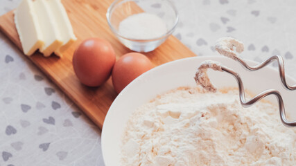 Mixer with dough for homemade pancakes. Breakfast for someone special concept. Top view, selective focus