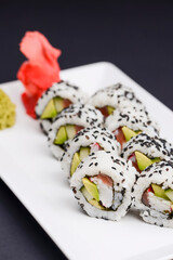 Maki Sushi - Roll made of smoked salmon and cream cheese. Traditional Japanese cuisine concept,...