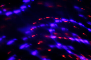 Blur colorful neon light leaks on black background. Defocused illuminated abstract futuristic texture for using over photos as overlay or screen filter