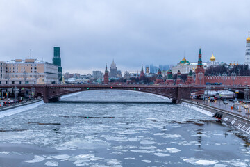 Moscow spring cityscape. Ice floes of different sizes floats on the surface of Moskva river near Red Square and Kremlin in the middle of Moscow city in Russia. Travel in Russia theme.