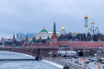 Moscow spring cityscape. Ice floes of different sizes floats on the surface of Moskva river near Red Square and Kremlin in the middle of Moscow city in Russia. Travel in Russia theme.
