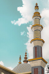 Fototapeta na wymiar Mosque tower with dark cloud