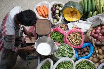 Bangalore, India, August, 2014 : street vendor selling vegetables in Bangalore India
