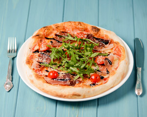 Christmas pizza on the wood board. Holiday celebration pizza. Italian cuisine concept.