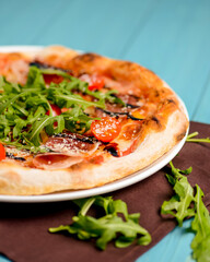 Christmas pizza on the wood board. Holiday celebration pizza. Italian cuisine concept.