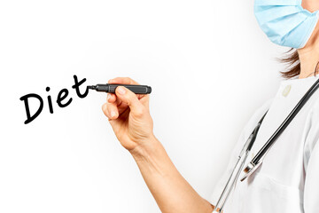 Doctor with mask writing the word diet on a white background