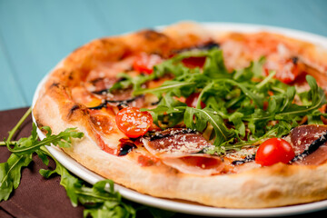 Christmas pizza on the wood board. Holiday celebration pizza. Italian cuisine concept.