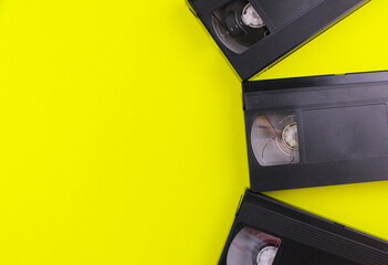 Yellow background with old videotape. Retro technology