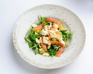 Salad - smoked salmon with vegetables and grapes. Delicious unique recipe, healthy salad for dinner.