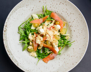 Salad - smoked salmon with vegetables and grapes. Delicious unique recipe, healthy salad for dinner.
