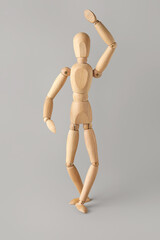 Wooden mannequin on light background