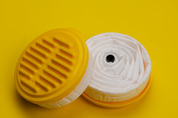 New replacement filters for Industrial respirator on yellow background.