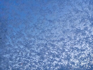 Fototapeta na wymiar Snow and ice on the glass of the car. 