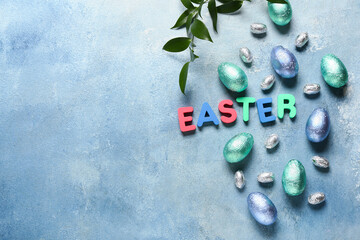 Beautiful composition with chocolate Easter eggs on color background