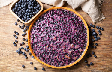 blueberry pie and fresh berries, top view