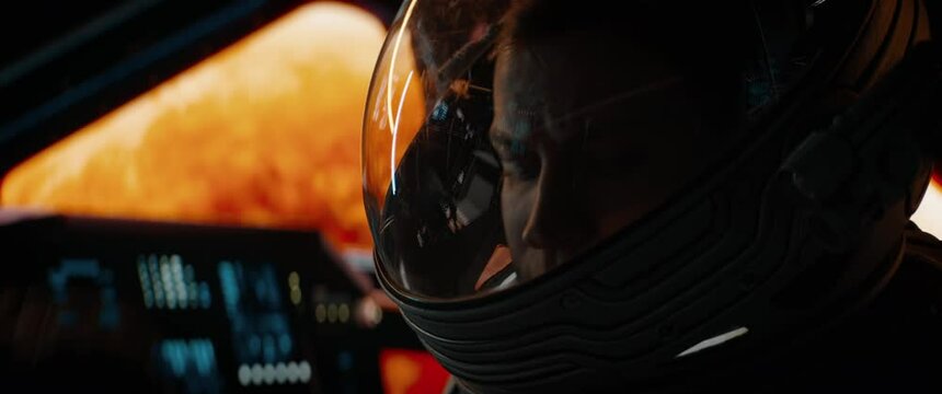 Portrait of Caucasian male astronaut inside spaceship cockpit. Sci-fi space exploration concept. Mars mission. Shot with 2x Anamorphic lens