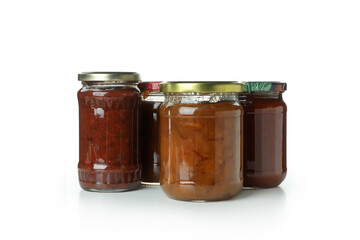 Jars with different canned jam isolated on white background