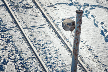 Loudspeaker at the pole on railroad tracks. Old megaphone on railroad pole. Railway announcement...